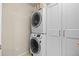 Convenient laundry room with stackable washer and dryer and lots of extra storage at 17925 E Maplewood Dr, Aurora, CO 80016