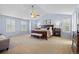 Spacious main bedroom features a ceiling fan, plantation shutters, and an ensuite bathroom at 17925 E Maplewood Dr, Aurora, CO 80016