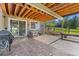 Covered patio with an outdoor grill, seating area and landscape views at 17925 E Maplewood Dr, Aurora, CO 80016