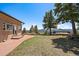 This property features a well-manicured backyard and an amazing deck overlooking the mountains at 5197 Bear Mountain Dr, Evergreen, CO 80439