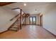 View of the basement stairs and walk-out doors to the exterior, featuring wooden trim at 5197 Bear Mountain Dr, Evergreen, CO 80439