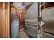 Basement mechanical area housing the water heater and HVAC systems, offering essential utilities at 5197 Bear Mountain Dr, Evergreen, CO 80439