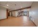 Finished basement offers tile floors, wooden stairs, and walkout access, creating an inviting space at 5197 Bear Mountain Dr, Evergreen, CO 80439