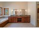 Elegant bathroom with double vanity, granite counters, a soaking tub, and a large window at 5197 Bear Mountain Dr, Evergreen, CO 80439