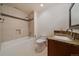 Bathroom featuring a tile backsplash, soaking tub and vanity with granite counters at 5197 Bear Mountain Dr, Evergreen, CO 80439