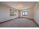 Spacious bedroom with two windows showing off beautiful scenic views at 5197 Bear Mountain Dr, Evergreen, CO 80439