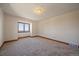 Bright bedroom with a large window capturing the landscape and scenic views at 5197 Bear Mountain Dr, Evergreen, CO 80439