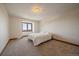Bedroom featuring an expansive window with scenic views, and carpeted floors at 5197 Bear Mountain Dr, Evergreen, CO 80439