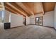 The dining room features vaulted wood ceilings, hardwood floors, a chandelier, and access to other rooms at 5197 Bear Mountain Dr, Evergreen, CO 80439