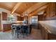 Stunning kitchen with wood cabinets, stainless appliances, granite counters, large island, and natural lighting at 5197 Bear Mountain Dr, Evergreen, CO 80439