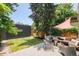 Enjoy this outdoor deck space with stylish seating, lovely greenery, and shade for relaxing or entertaining at 2228 N Race St, Denver, CO 80205