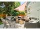 Comfortable outdoor seating area on a deck in the backyard with a shade sail at 2228 N Race St, Denver, CO 80205