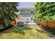 Green backyard with a large deck and nice landscaping at 2228 N Race St, Denver, CO 80205