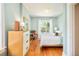 Light-filled bedroom features hardwood floors, closet, neutral tones, and a large window at 2228 N Race St, Denver, CO 80205