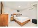 Cozy basement bedroom with carpet, natural light, wooden bed frame, and black bedside lamps at 2228 N Race St, Denver, CO 80205