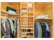 Walk-in closet with custom wood shelving, multiple storage areas, clothing rods and ample space at 2228 N Race St, Denver, CO 80205