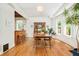 Dining room with wood floors, built-in cabinet, and natural light at 2228 N Race St, Denver, CO 80205