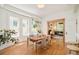 Dining room with hardwood floors, table, chairs, and bright windows with light flowing throughout at 2228 N Race St, Denver, CO 80205