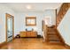 Foyer features hardwood floors, staircase and vintage window details at 2228 N Race St, Denver, CO 80205