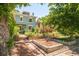 Charming two-story home with a well-maintained front yard and garden at 2228 N Race St, Denver, CO 80205