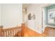 Hallway with wood floors and trim leading to an open room with bright natural light at 2228 N Race St, Denver, CO 80205