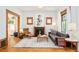 Bright living room features hardwood floors, fireplace, and large windows for natural light at 2228 N Race St, Denver, CO 80205