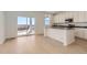 Modern kitchen featuring stainless steel appliances and sliding doors to the backyard at 710 N Deer Park, Watkins, CO 80137