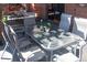 Back deck dining area features a glass table and seating for six at 783 Calgary Way, Golden, CO 80401