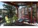 Covered back deck with ski lift chairs and seating for outdoor enjoyment at 783 Calgary Way, Golden, CO 80401