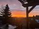 Scenic sunset view from the back deck with an outdoor dining area at 783 Calgary Way, Golden, CO 80401