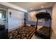 Finished basement featuring a stationary bike, treadmill and large decorative rug at 783 Calgary Way, Golden, CO 80401