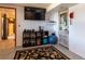Finished basement featuring weight training equipment and a decorative door at 783 Calgary Way, Golden, CO 80401