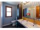 Well-lit bathroom with double sinks, modern fixtures, and a stylish mirror provides a clean and updated space at 783 Calgary Way, Golden, CO 80401