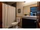 Bathroom features a shower with gray tile and a vanity with a modern sink at 783 Calgary Way, Golden, CO 80401