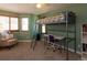 Spacious green bedroom featuring a lofted bed and seating area near the window at 783 Calgary Way, Golden, CO 80401
