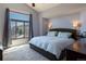 Comfortable bedroom with a large window offering beautiful mountain views and natural light at 783 Calgary Way, Golden, CO 80401