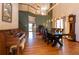 Charming dining room with wood floors, piano, and stylish decor at 783 Calgary Way, Golden, CO 80401