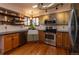 Well-appointed kitchen featuring stainless steel appliances, granite counters, and subway tile backsplash at 783 Calgary Way, Golden, CO 80401