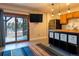 Living area with sliding glass doors to a balcony and a modern kitchen at 783 Calgary Way, Golden, CO 80401