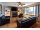 Comfortable living room features a fireplace, built-in shelving and a large window offering plenty of natural light at 783 Calgary Way, Golden, CO 80401