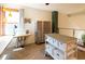 Bright office with a sewing station, desk, crafting table, large window, and natural light at 783 Calgary Way, Golden, CO 80401