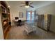Spacious office featuring a custom desk, built-in shelving, and an abundance of natural light at 783 Calgary Way, Golden, CO 80401