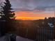 Breathtaking sunset view from balcony, perfect for enjoying serene evenings and beautiful scenery at 783 Calgary Way, Golden, CO 80401