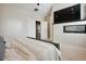 Main bedroom with king bed, fireplace, and access to other rooms at 147 Chapel Hill Cir, Brighton, CO 80601