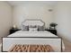 Main bedroom with a king-size bed, and stylish decor at 147 Chapel Hill Cir, Brighton, CO 80601