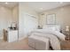 Bright bedroom with a queen-size bed, vanity, and large closet at 147 Chapel Hill Cir, Brighton, CO 80601
