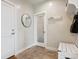 Bright entry with tile flooring, bench, and access to a private room at 147 Chapel Hill Cir, Brighton, CO 80601