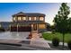 Two-story house with landscaped yard, large driveway, and three-car garage at 147 Chapel Hill Cir, Brighton, CO 80601