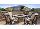 Cozy fire pit with seating area perfect for outdoor gatherings at 147 Chapel Hill Cir, Brighton, CO 80601