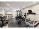Basement home gym, with a treadmill, Bowflex and weights at 147 Chapel Hill Cir, Brighton, CO 80601